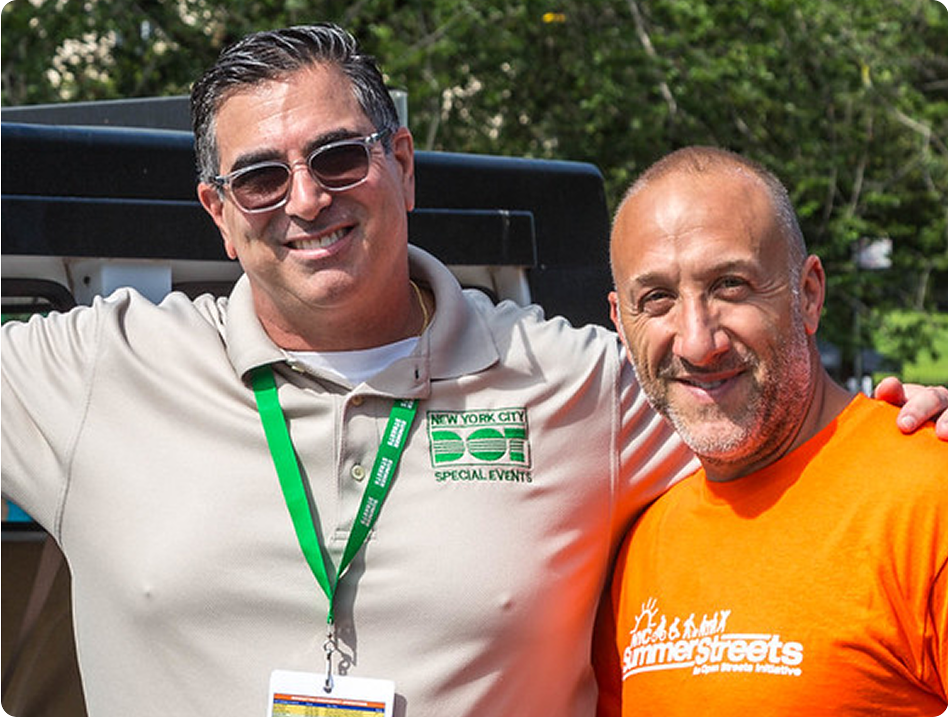 Close-up photo of two men outside